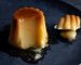 Spanish dessert flan with sauce served on plate. Closeup